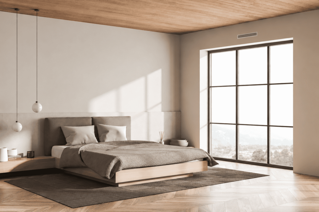 Chambre climatisée par une grille de soufflage au plafond, confort d’été avec une consigne autour de 26 °C